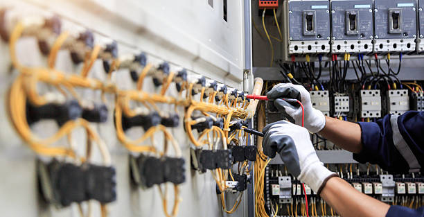 Professional Electrician technician working in Village Green, NY